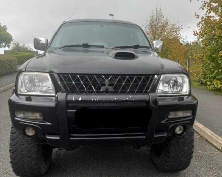 Черный Мицубиси Л 200, объемом двигателя 2.5 л и пробегом 150 тыс. км за 6500 $, фото 1 на Automoto.ua