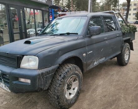 Черный Мицубиси Л 200, объемом двигателя 0 л и пробегом 217 тыс. км за 4300 $, фото 1 на Automoto.ua