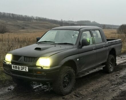 Черный Мицубиси Л 200, объемом двигателя 0 л и пробегом 232 тыс. км за 4100 $, фото 1 на Automoto.ua