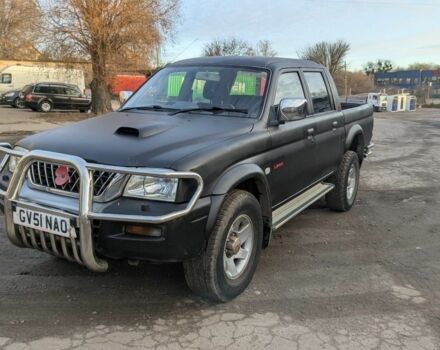 Черный Мицубиси Л 200, объемом двигателя 2.5 л и пробегом 165 тыс. км за 4830 $, фото 1 на Automoto.ua