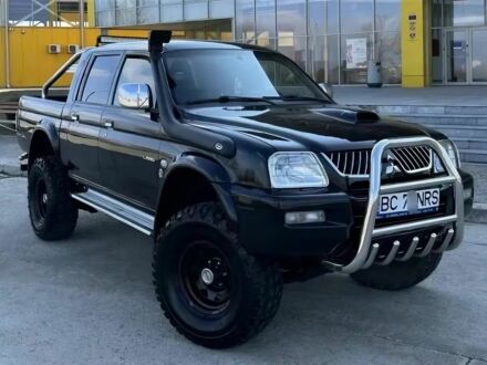 Мицубиси Л 200 2003 в Сумах на Automoto.ua Черный Мицубиси Л 200, объемом двигателя 2.5 л и пробегом 255 тыс. км за 2500 $, фото 1 на Automoto.ua
