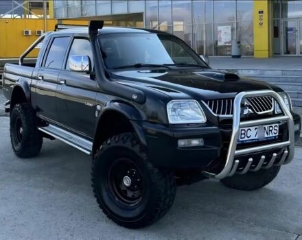 Черный Мицубиси Л 200, объемом двигателя 2.5 л и пробегом 255 тыс. км за 2500 $, фото 1 на Automoto.ua