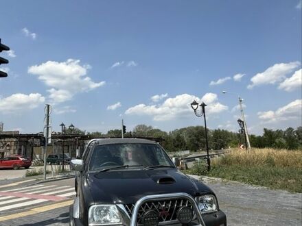 Міцубісі Л 200 2003 у Изюме на Automoto.ua Чорний Міцубісі Л 200, об'ємом двигуна 2.5 л та пробігом 140 тис. км за 6500 $, фото 1 на Automoto.ua