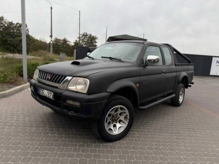 Мицубиси Л 200 2003 в Днепре (Днепропетровске) на Automoto.ua Черный Мицубиси Л 200, объемом двигателя 2.5 л и пробегом 200 тыс. км за 4450 $, фото 1 на Automoto.ua