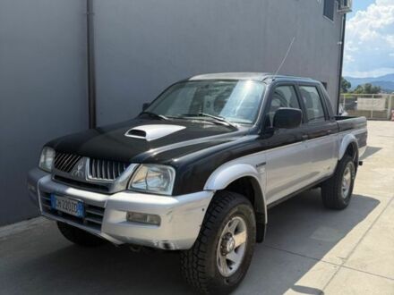 Мицубиси Л 200 2003 в Днепре (Днепропетровске) на Automoto.ua Черный Мицубиси Л 200, объемом двигателя 2.5 л и пробегом 266 тыс. км за 2600 $, фото 1 на Automoto.ua