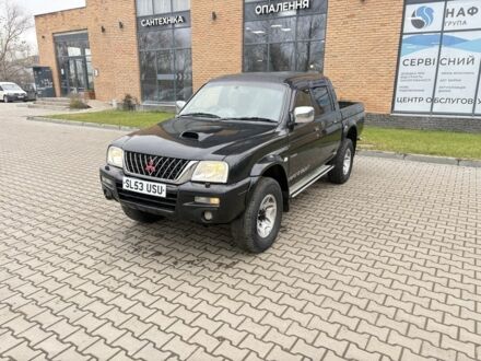 Чорний Міцубісі Л 200, об'ємом двигуна 2.5 л та пробігом 167 тис. км за 6647 $, фото 1 на Automoto.ua