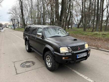 Чорний Міцубісі Л 200, об'ємом двигуна 2.5 л та пробігом 167 тис. км за 5674 $, фото 1 на Automoto.ua