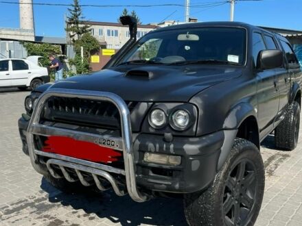 Чорний Міцубісі Л 200, об'ємом двигуна 2.5 л та пробігом 225 тис. км за 4450 $, фото 1 на Automoto.ua