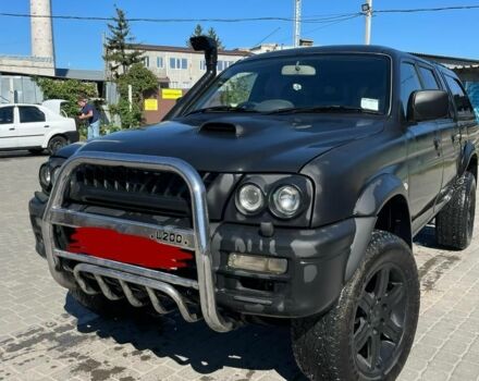 Черный Мицубиси Л 200, объемом двигателя 2.5 л и пробегом 225 тыс. км за 4450 $, фото 1 на Automoto.ua