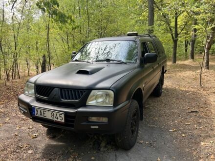 Мицубиси Л 200 2004 в Днепре (Днепропетровске) на Automoto.ua Черный Мицубиси Л 200, объемом двигателя 2.5 л и пробегом 250 тыс. км за 5500 $, фото 1 на Automoto.ua