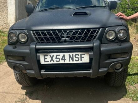 Черный Мицубиси Л 200, объемом двигателя 2.5 л и пробегом 250 тыс. км за 4500 $, фото 1 на Automoto.ua