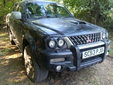 Мицубиси Л 200 2004 в Краматорске на Automoto.ua Черный Мицубиси Л 200, объемом двигателя 2.5 л и пробегом 150 тыс. км за 4800 $, фото 1 на Automoto.ua