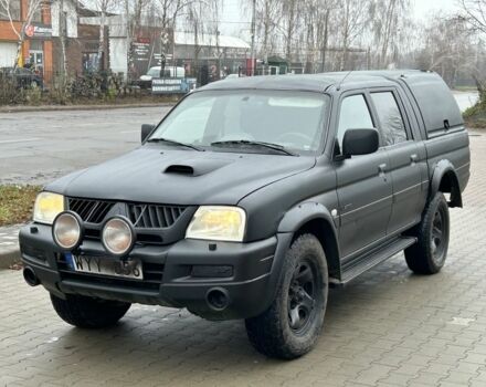 Черный Мицубиси Л 200, объемом двигателя 2.5 л и пробегом 250 тыс. км за 4250 $, фото 1 на Automoto.ua