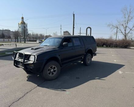 Чорний Міцубісі Л 200, об'ємом двигуна 2.5 л та пробігом 300 тис. км за 4600 $, фото 1 на Automoto.ua