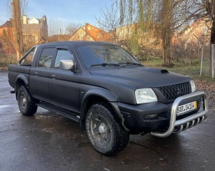 Черный Мицубиси Л 200, объемом двигателя 2.5 л и пробегом 250 тыс. км за 5300 $, фото 1 на Automoto.ua