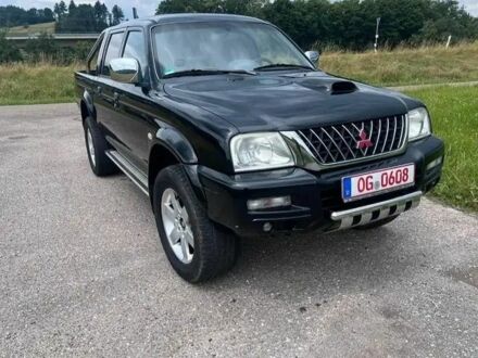 Чорний Міцубісі Л 200, об'ємом двигуна 2.5 л та пробігом 224 тис. км за 2700 $, фото 1 на Automoto.ua