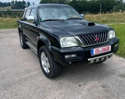 Черный Мицубиси Л 200, объемом двигателя 2.5 л и пробегом 224 тыс. км за 2700 $, фото 1 на Automoto.ua