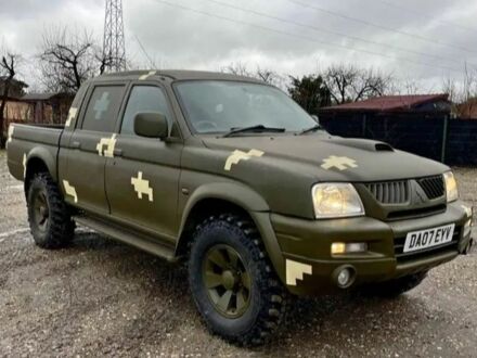 Черный Мицубиси Л 200, объемом двигателя 2.5 л и пробегом 221 тыс. км за 2550 $, фото 1 на Automoto.ua