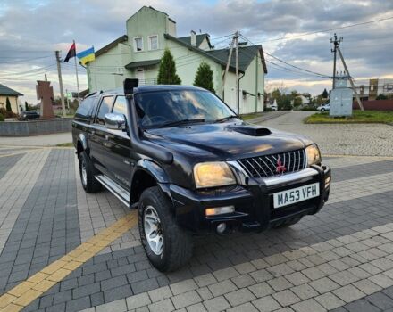 Черный Мицубиси Л 200, объемом двигателя 2.5 л и пробегом 156 тыс. км за 7521 $, фото 1 на Automoto.ua