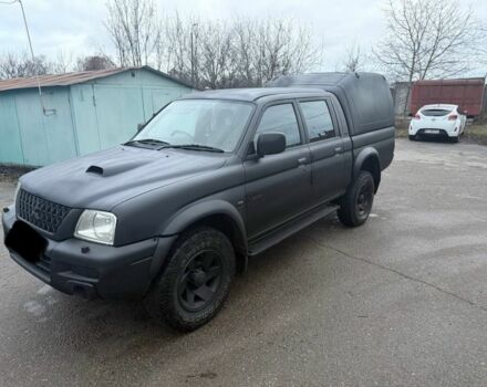 Черный Мицубиси Л 200, объемом двигателя 2.5 л и пробегом 150 тыс. км за 4650 $, фото 1 на Automoto.ua