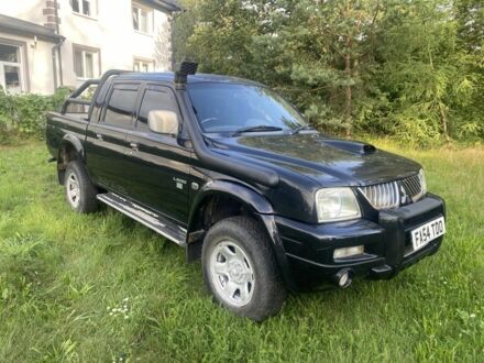 Мицубиси Л 200 2005 в Ровно на Automoto.ua Черный Мицубиси Л 200, объемом двигателя 2.5 л и пробегом 91 тыс. км за 4500 $, фото 1 на Automoto.ua