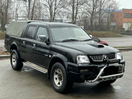 Черный Мицубиси Л 200, объемом двигателя 2.5 л и пробегом 170 тыс. км за 4250 $, фото 1 на Automoto.ua