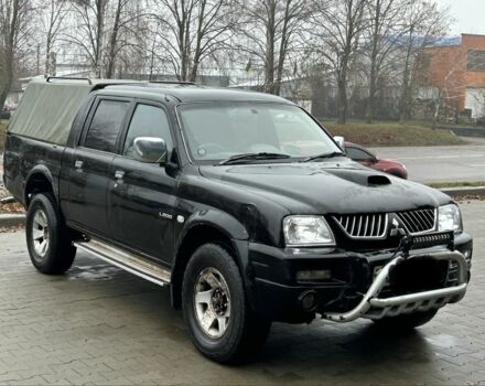 Черный Мицубиси Л 200, объемом двигателя 2.5 л и пробегом 170 тыс. км за 4250 $, фото 1 на Automoto.ua