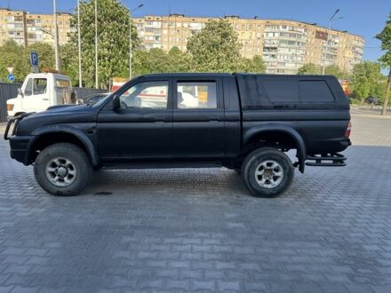 Мицубиси Л 200 2006 в Кривом Роге на Automoto.ua Черный Мицубиси Л 200, объемом двигателя 2.5 л и пробегом 225 тыс. км за 4000 $, фото 1 на Automoto.ua
