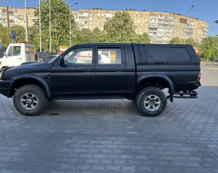 Черный Мицубиси Л 200, объемом двигателя 2.5 л и пробегом 225 тыс. км за 4000 $, фото 1 на Automoto.ua