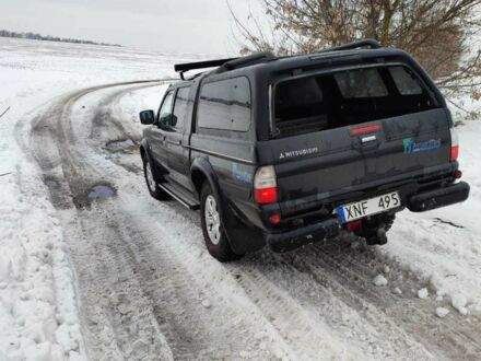 Чорний Міцубісі Л 200, об'ємом двигуна 0.25 л та пробігом 270 тис. км за 6257 $, фото 1 на Automoto.ua