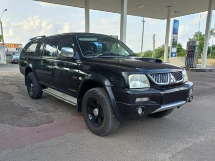 Мицубиси Л 200 2006 в Днепре (Днепропетровске) на Automoto.ua Черный Мицубиси Л 200, объемом двигателя 2.5 л и пробегом 240 тыс. км за 5300 $, фото 1 на Automoto.ua