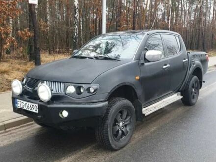 Черный Мицубиси Л 200, объемом двигателя 2.5 л и пробегом 257 тыс. км за 4000 $, фото 1 на Automoto.ua