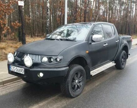 Черный Мицубиси Л 200, объемом двигателя 2.5 л и пробегом 257 тыс. км за 4000 $, фото 1 на Automoto.ua