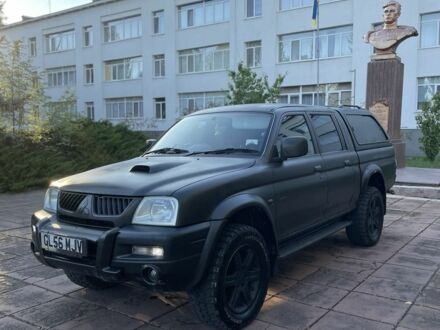 Мицубиси Л 200 2007 в Славянске на Automoto.ua Черный Мицубиси Л 200, объемом двигателя 2.5 л и пробегом 165 тыс. км за 3700 $, фото 1 на Automoto.ua