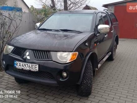 Черный Мицубиси Л 200, объемом двигателя 2.48 л и пробегом 198 тыс. км за 11500 $, фото 1 на Automoto.ua