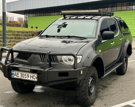 Черный Мицубиси Л 200, объемом двигателя 2.5 л и пробегом 185 тыс. км за 13500 $, фото 1 на Automoto.ua