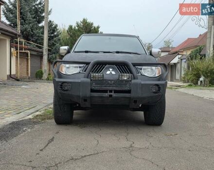 Черный Мицубиси Л 200, объемом двигателя 2.48 л и пробегом 186 тыс. км за 12200 $, фото 1 на Automoto.ua