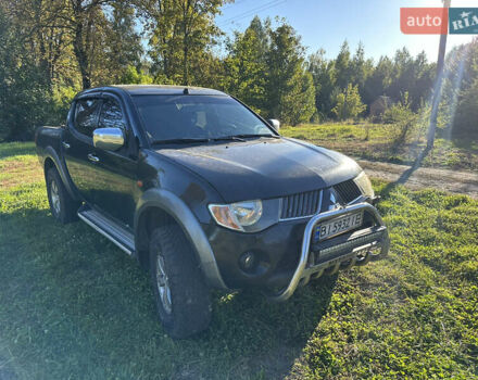 Черный Мицубиси Л 200, объемом двигателя 2.48 л и пробегом 320 тыс. км за 7500 $, фото 1 на Automoto.ua