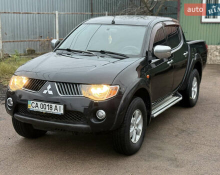 Черный Мицубиси Л 200, объемом двигателя 2.5 л и пробегом 261 тыс. км за 12300 $, фото 1 на Automoto.ua