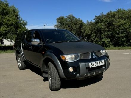 Мицубиси Л 200 2008 в Харькове на Automoto.ua Черный Мицубиси Л 200, объемом двигателя 2.5 л и пробегом 180 тыс. км за 6300 $, фото 1 на Automoto.ua