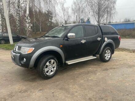 Черный Мицубиси Л 200, объемом двигателя 2.5 л и пробегом 145 тыс. км за 6800 $, фото 1 на Automoto.ua