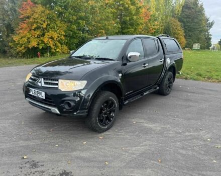 Черный Мицубиси Л 200, объемом двигателя 2.5 л и пробегом 235 тыс. км за 3300 $, фото 1 на Automoto.ua