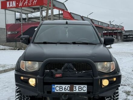 Черный Мицубиси Л 200, объемом двигателя 2.5 л и пробегом 230 тыс. км за 8500 $, фото 1 на Automoto.ua