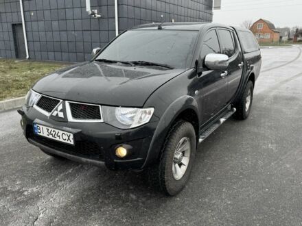 Черный Мицубиси Л 200, объемом двигателя 2.5 л и пробегом 270 тыс. км за 16500 $, фото 1 на Automoto.ua