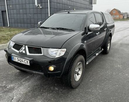 Черный Мицубиси Л 200, объемом двигателя 2.5 л и пробегом 270 тыс. км за 16500 $, фото 1 на Automoto.ua