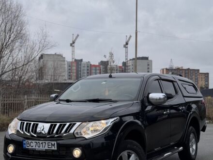 Черный Мицубиси Л 200, объемом двигателя 2.4 л и пробегом 186 тыс. км за 22200 $, фото 1 на Automoto.ua