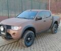 Коричневый Мицубиси Л 200, объемом двигателя 2.5 л и пробегом 298 тыс. км за 3250 $, фото 1 на Automoto.ua