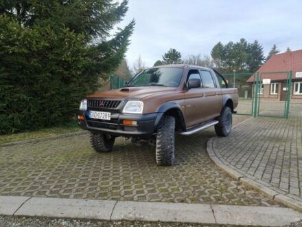 Коричневый Мицубиси Л 200, объемом двигателя 2.5 л и пробегом 287 тыс. км за 2300 $, фото 1 на Automoto.ua