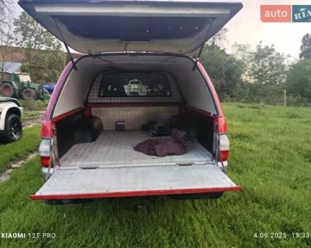 Красный Мицубиси Л 200, объемом двигателя 2.5 л и пробегом 272 тыс. км за 3200 $, фото 4 на Automoto.ua