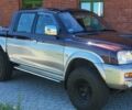 Червоний Міцубісі Л 200, об'ємом двигуна 2.5 л та пробігом 230 тис. км за 1950 $, фото 2 на Automoto.ua